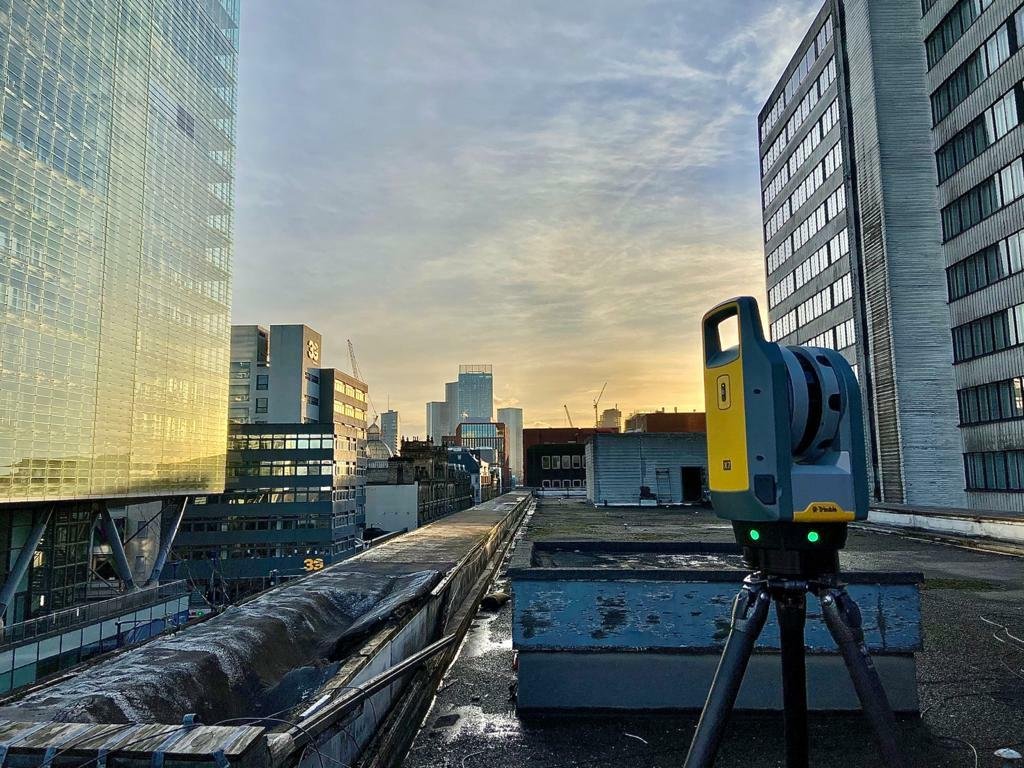 Trimble X7 laser scanner conducting measured building survey on commercial building rooftop in London
