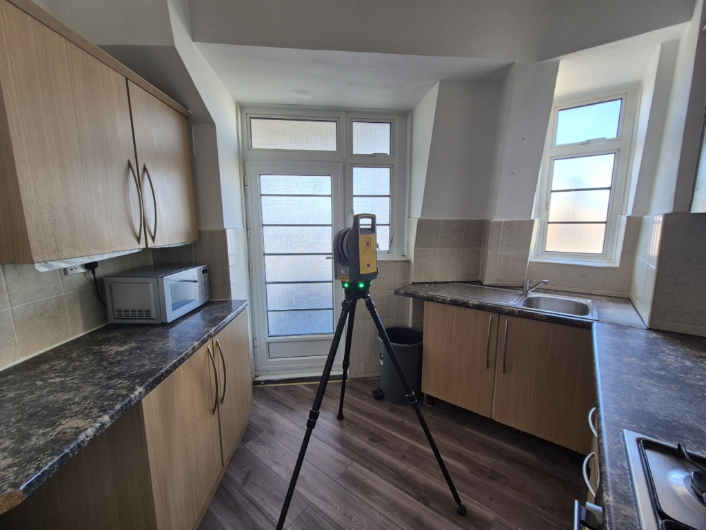 Trimble X7 laser scanner set up in kitchen during measured building survey