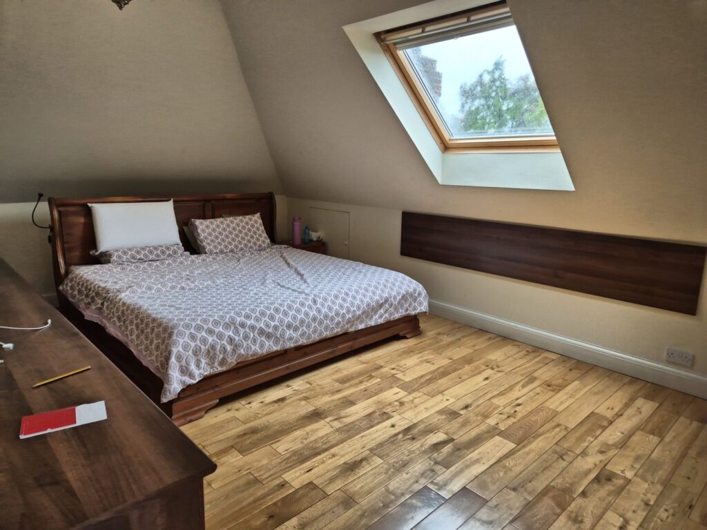 Loft conversion bedroom with Velux window during measured building survey, Orpington BR6