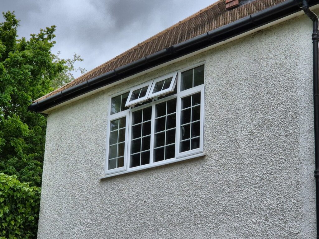 Side gable elevation of detached house during measured building survey, Orpington BR6